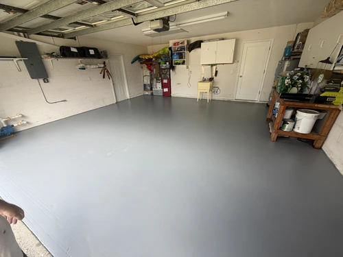The same Daytona Beach garage floor finished in a uniform grey coating